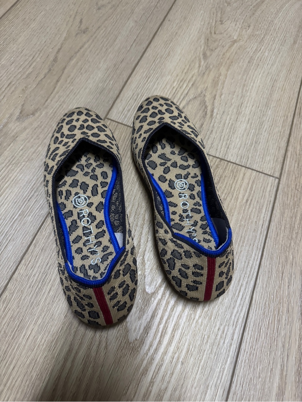 Rothy's Leopard Print Ballet Flats with Blue Trim and Red Detail